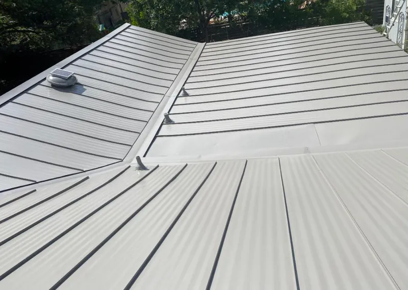 Solar attic fan installed on a metal roof for Roof Ventilation in Chico